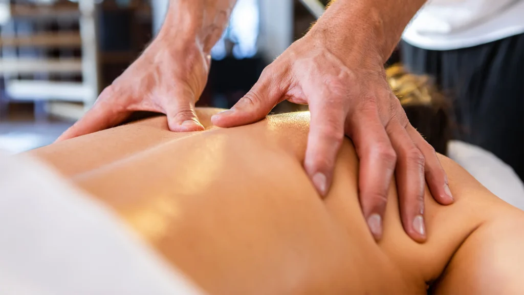 Close Up Two Hands Massaging A Back
