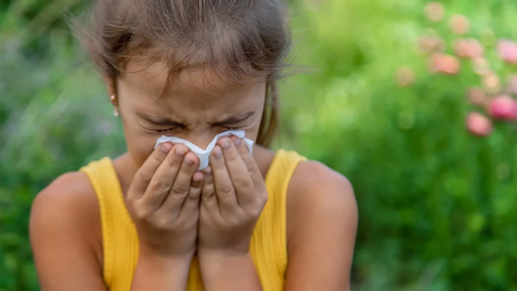 Girl Wiping Her Nose Outside