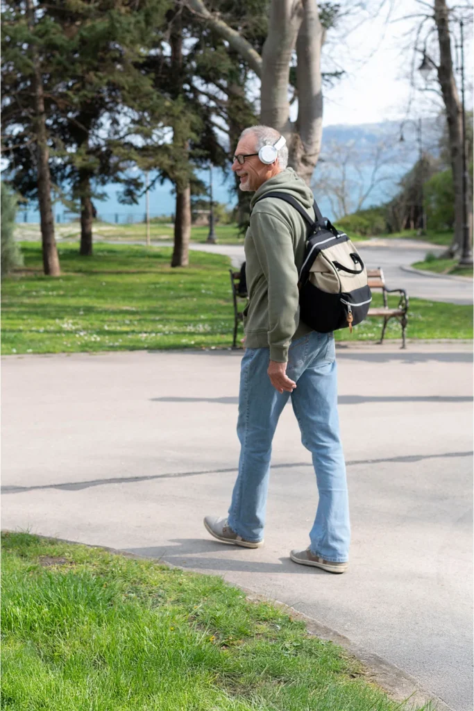 Happy Old Man Walks Outside In A Park