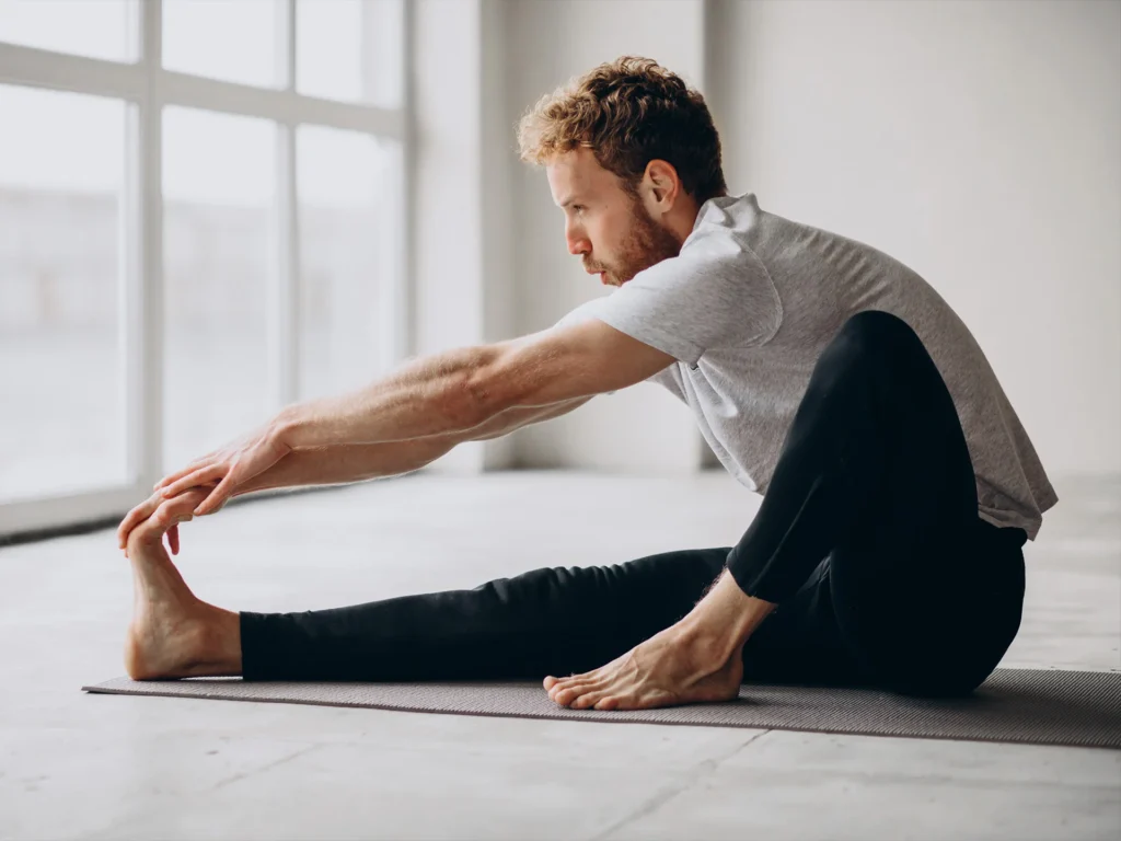 Man Stretching One Leg On The Floor